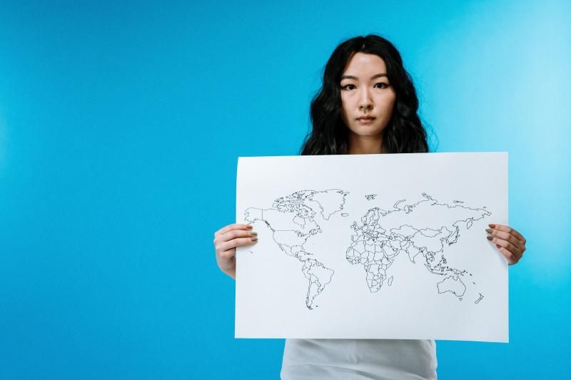 Women holding the world map (By cottonbro from pexels.com) Women holding the world map (By cottonbro from pexels.com)